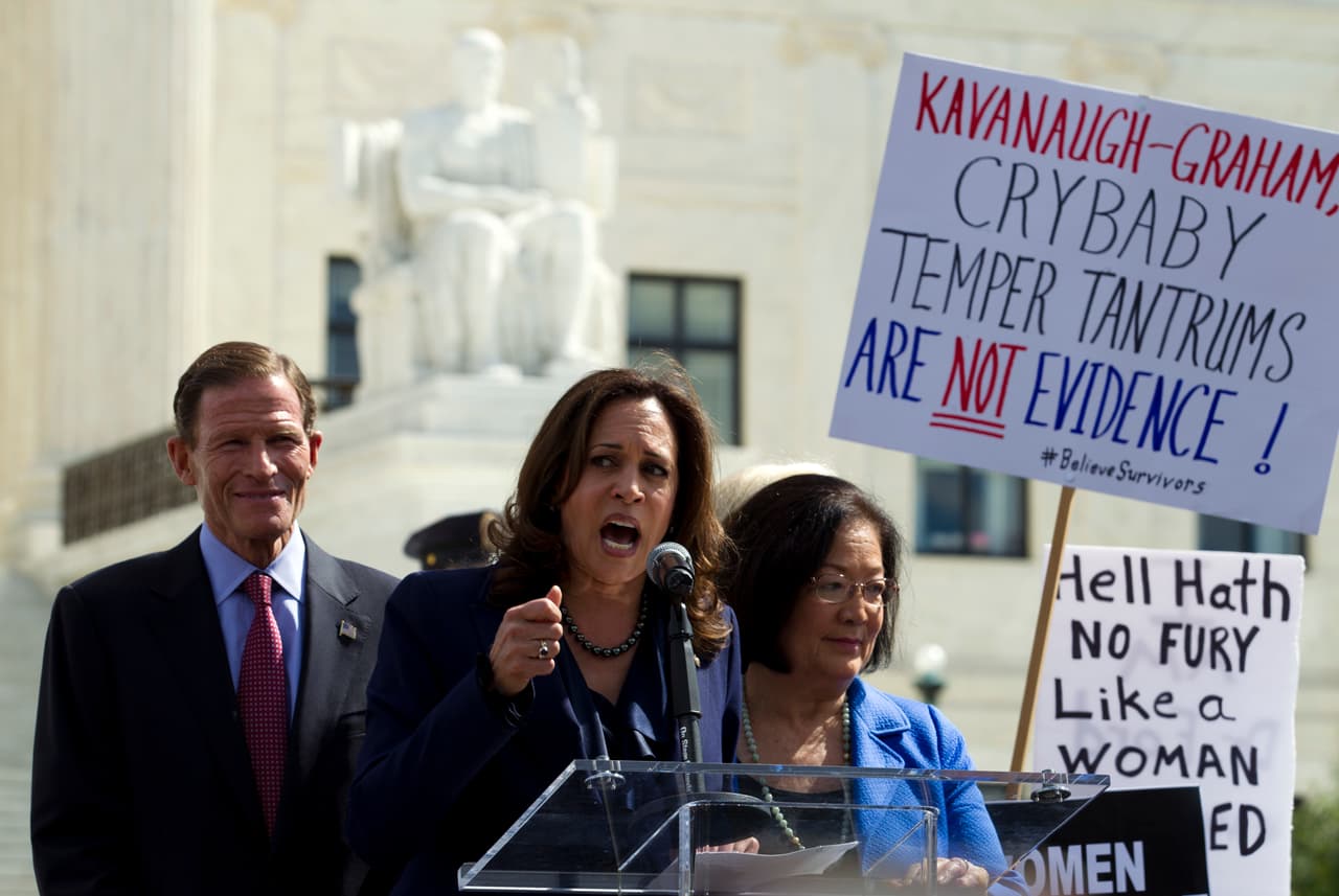 From left, Sen. Richard Blumenthal, D-Conn., Sen. Kamala Harris, D-Calif., Sen. Mazie Hirono, D-Hawaii, speak as protesters rally against Supreme Court nominee Brett Kavanaugh as the Senate Judiciary Committee debates his confirmation, Friday, Sept. 28, 2018, at the Supreme Court in Washington. (AP Photo/Jose Luis Magana)