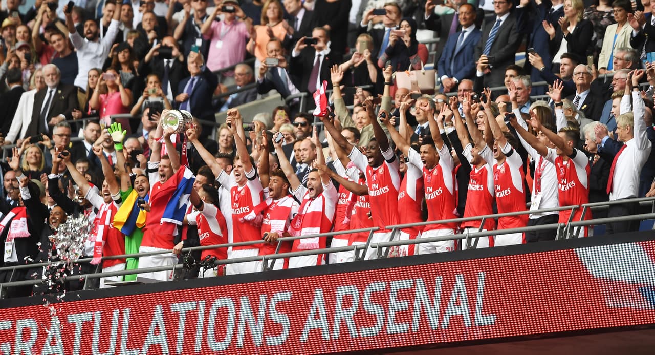 LONDON, ENGLAND - MAY 27: Per Mertesacker of Arsenal lifts The FA Cup after The Emirates FA Cup Final between Arsenal and Chelsea at Wembley Stadium on May 27, 2017 in London, England. (Photo by Mike Hewitt/Getty Images)