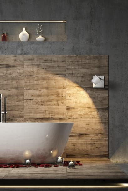 Tal vez no puedas derribar una pared y reconstruirla con ladrillo a la vista, pero sí puedes incluir materiales como hierro y acero, además de colores apagados como negro y gris.