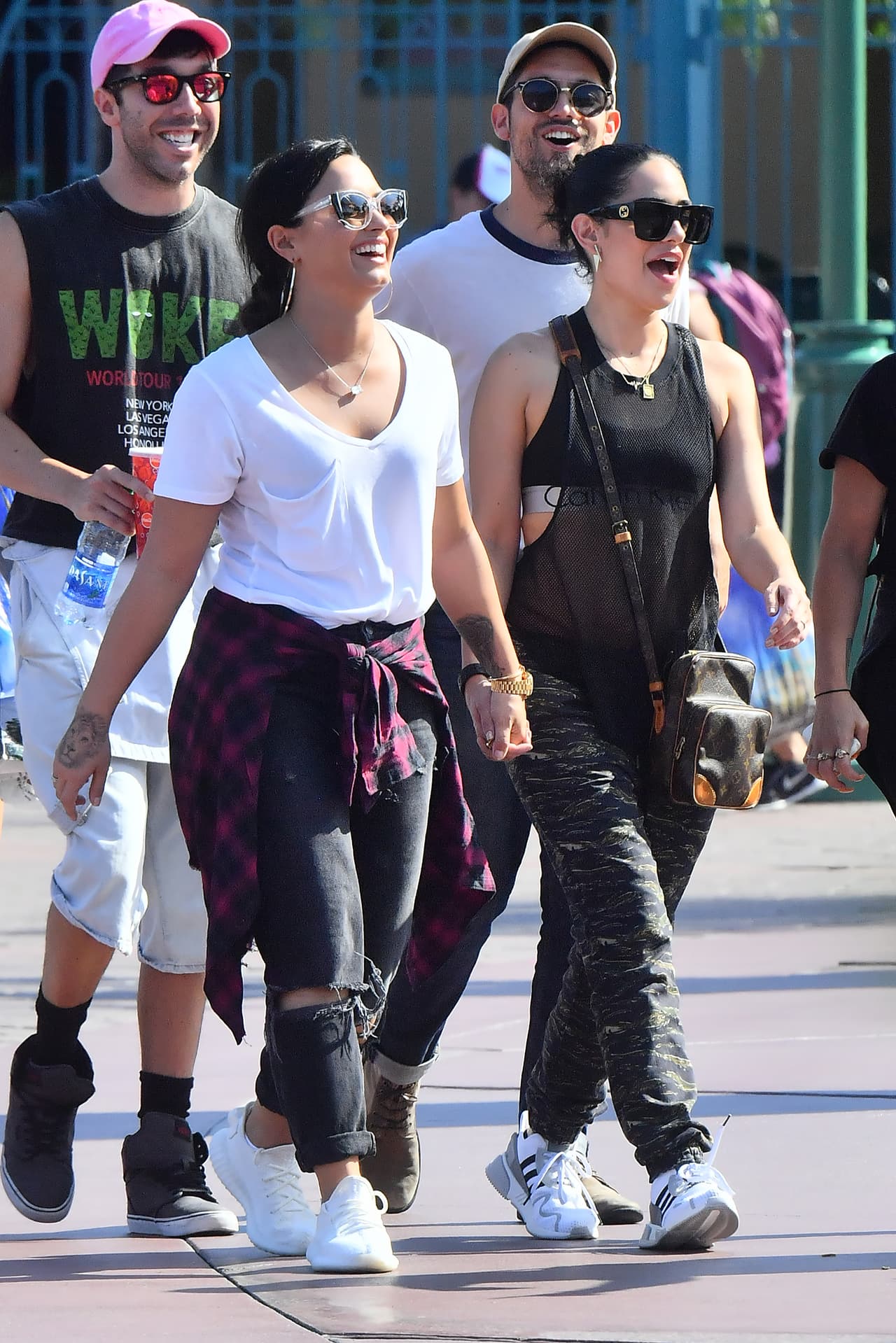 Photo © 2017 Mega/The Grosby Group EXCLUSIVE Los Angeles, CA September 11, 2017 Demi Lovato holds hands with a mystery woman while spending a happy day a Disneyland gets photobombed by Donald Duck. Demi and her new lady walked hand in hand all day Long as they enjoyed a day. they were seen riding the California screaming rollercoaster. Demi looked extremely happy.
