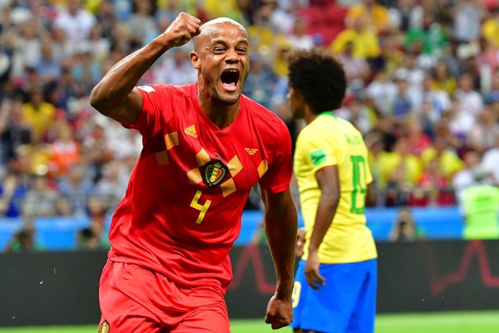 TOPSHOT - Belgium's defender Vincent Kompany celebrates after Brazil scored an own goal during the Russia 2018 World Cup quarter-final football match between Brazil and Belgium at the Kazan Arena in Kazan on July 6, 2018. (Photo by Luis Acosta / AFP) / RESTRICTED TO EDITORIAL USE - NO MOBILE PUSH ALERTS/DOWNLOADS (Photo credit should read LUIS ACOSTA/AFP/Getty Images)