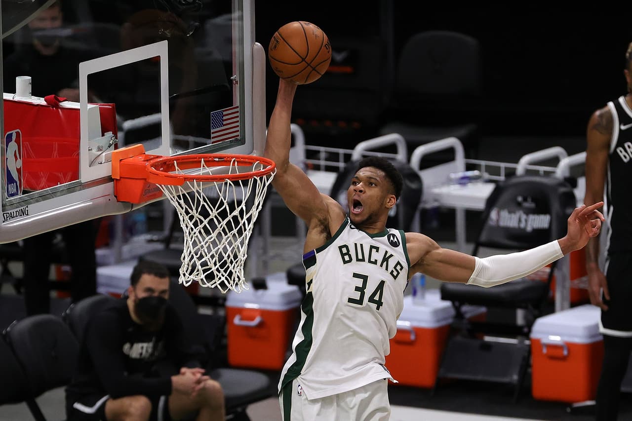 MILWAUKEE, WISCONSIN - JUNE 13: Giannis Antetokounmpo #34 of the Milwaukee Bucks dunks against the Brooklyn Nets during the second half of Game Four of the Eastern Conference second round playoff series at the Fiserv Forum on June 13, 2021 in Milwaukee, Wisconsin. NOTE TO USER: User expressly acknowledges and agrees that, by downloading and or using this photograph, User is consenting to the terms and conditions of the Getty Images License Agreement. (Photo by Stacy Revere/Getty Images)