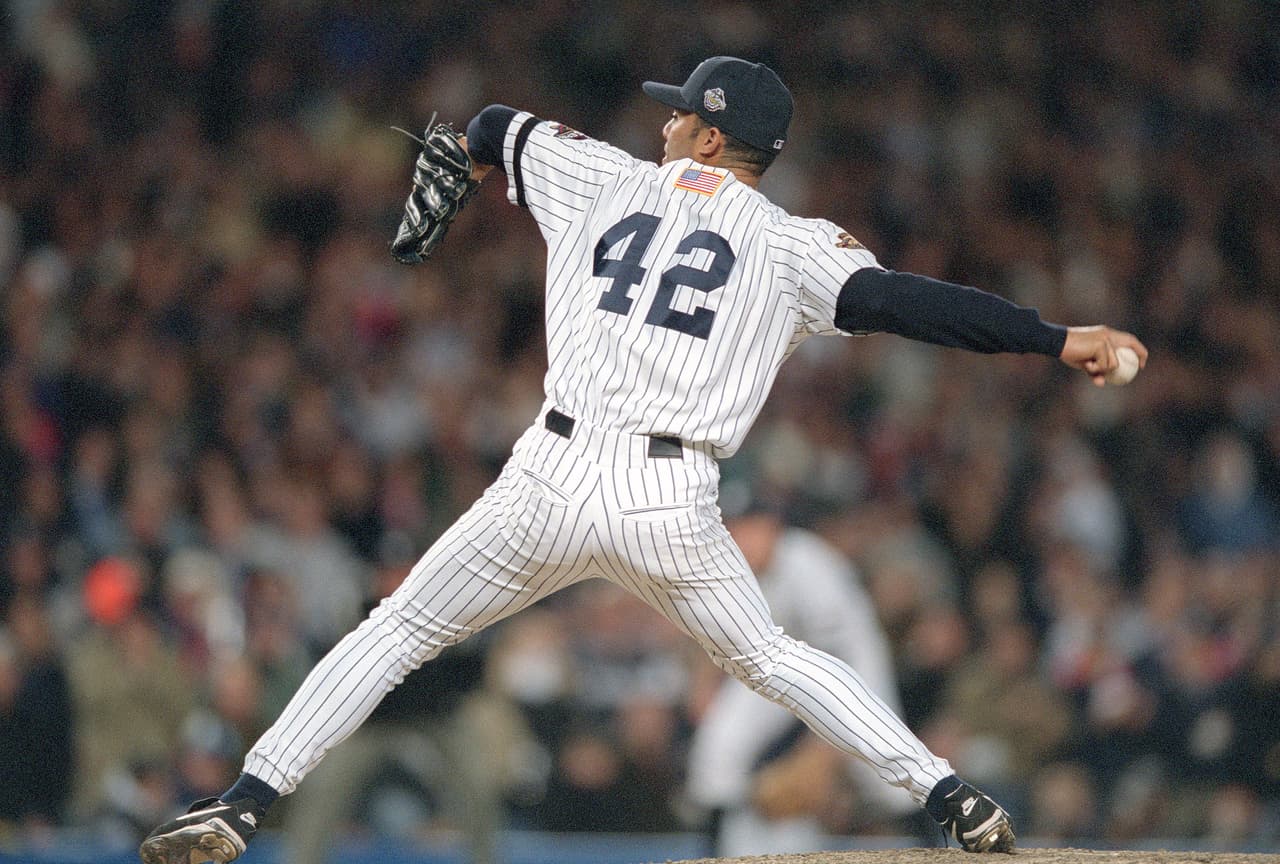 NEW YORK - CIRCA 2001 : Mariano Rivera #42 of the New York Yankees pitches against the Arizona Diamondbacks in the 2001 World Series at Yankee Stadium in the Bronx borough of New York City. The Diamondbacks won the series 4 games to 3. (Photo by Focus on Sport/Getty Images)