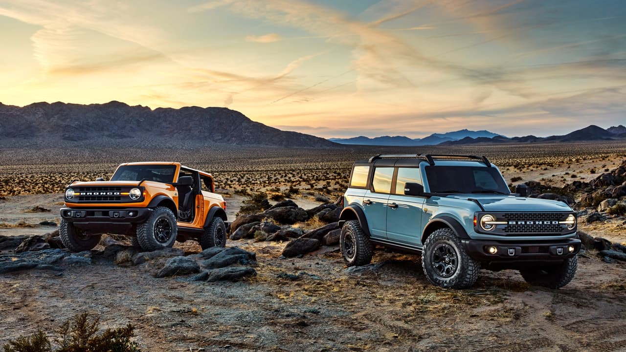 Pre-production versions of the 2021 Bronco, shown here, include Bronco two-door in Cyber Orange Metallic Tri-Coat and Bronco four-door in Cactus Gray.