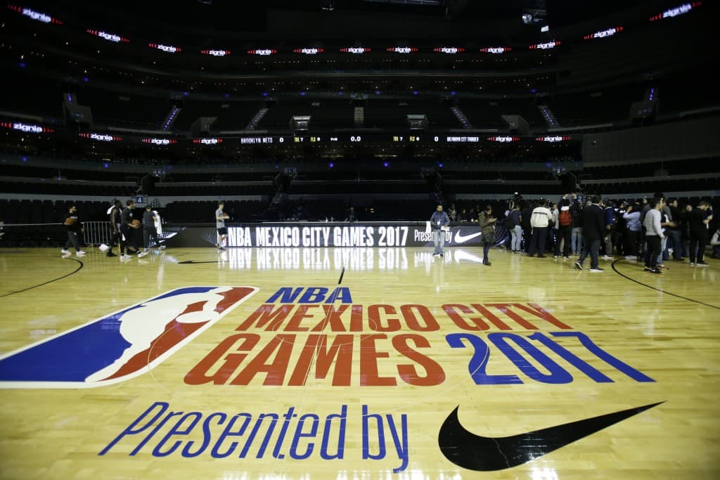 Journalists mingle with players following a Brooklyn Nets' training session at the Mexico City Arena in Mexico City, Wednesday, Dec. 6, 2017.