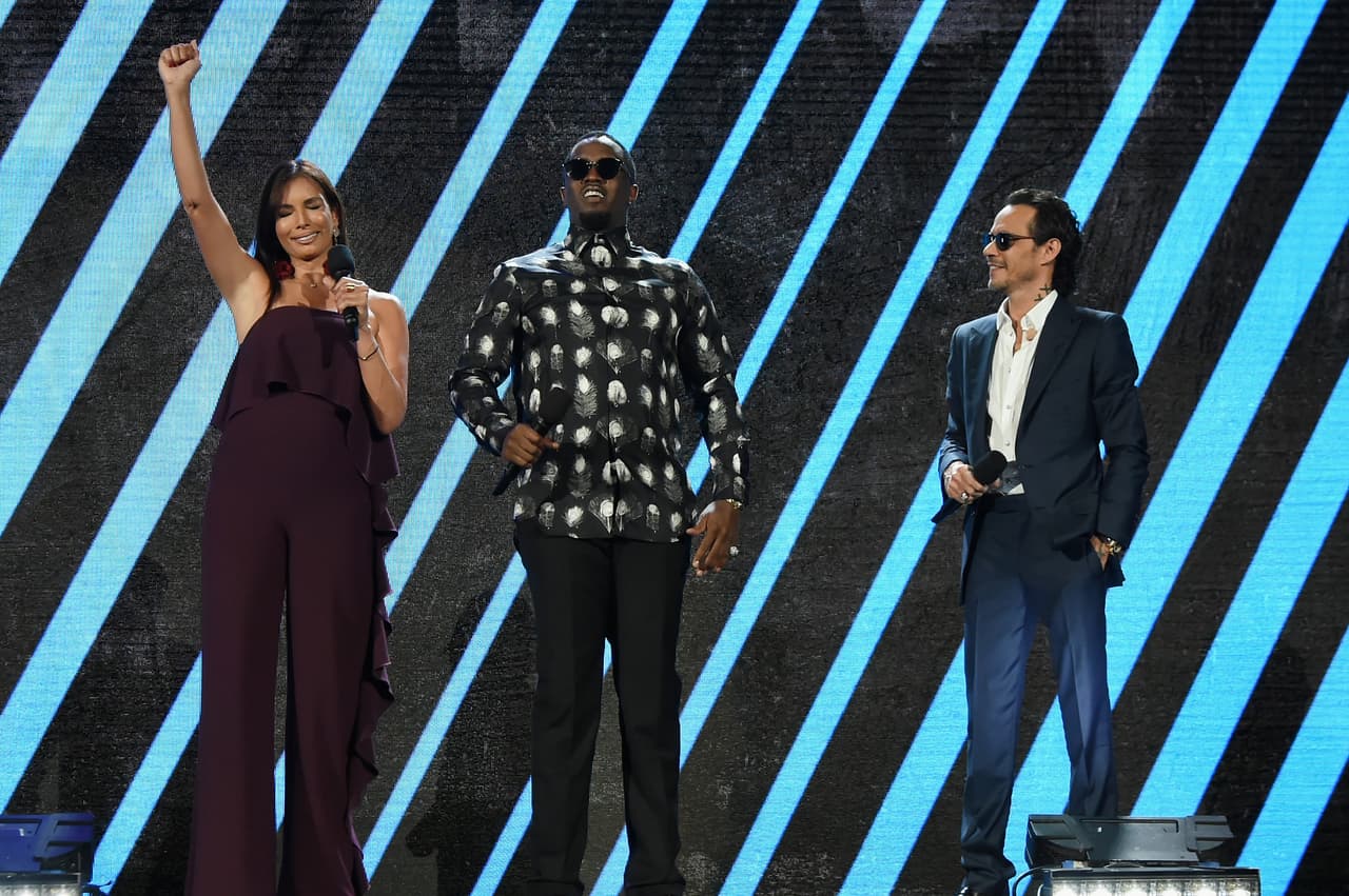 MIAMI, FL - OCTOBER 14: In this handout photo provided by One Voice: Somos Live!, Giselle Blondet, Sean Combs and Marc Anthony speak onstage at One Voice: Somos Live! A Concert For Disaster Relief at Marlins Park on October 14, 2017 in Miami, Florida. (Photo by Rick Diamond/One Voice: Somos Live!/Getty Images)