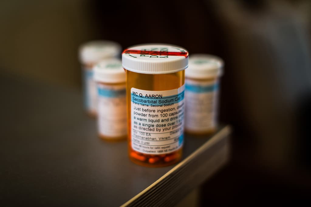 Aaron McQ's aid-in-dying prescription of secobarbital sodium. McQ had been battling leukemia and a rare form of amyotrophic lateral sclerosis, or ALS, for five years. In November, doctors gave him six months or less to live and confirmed that he qualified to use Washington state’s aid-in-dying law. McQ filled the prescription for lethal drugs in late December, planning to use them within the next several weeks. The hard part, he said, was deciding exactly when to die. (Dan DeLong for KHN)