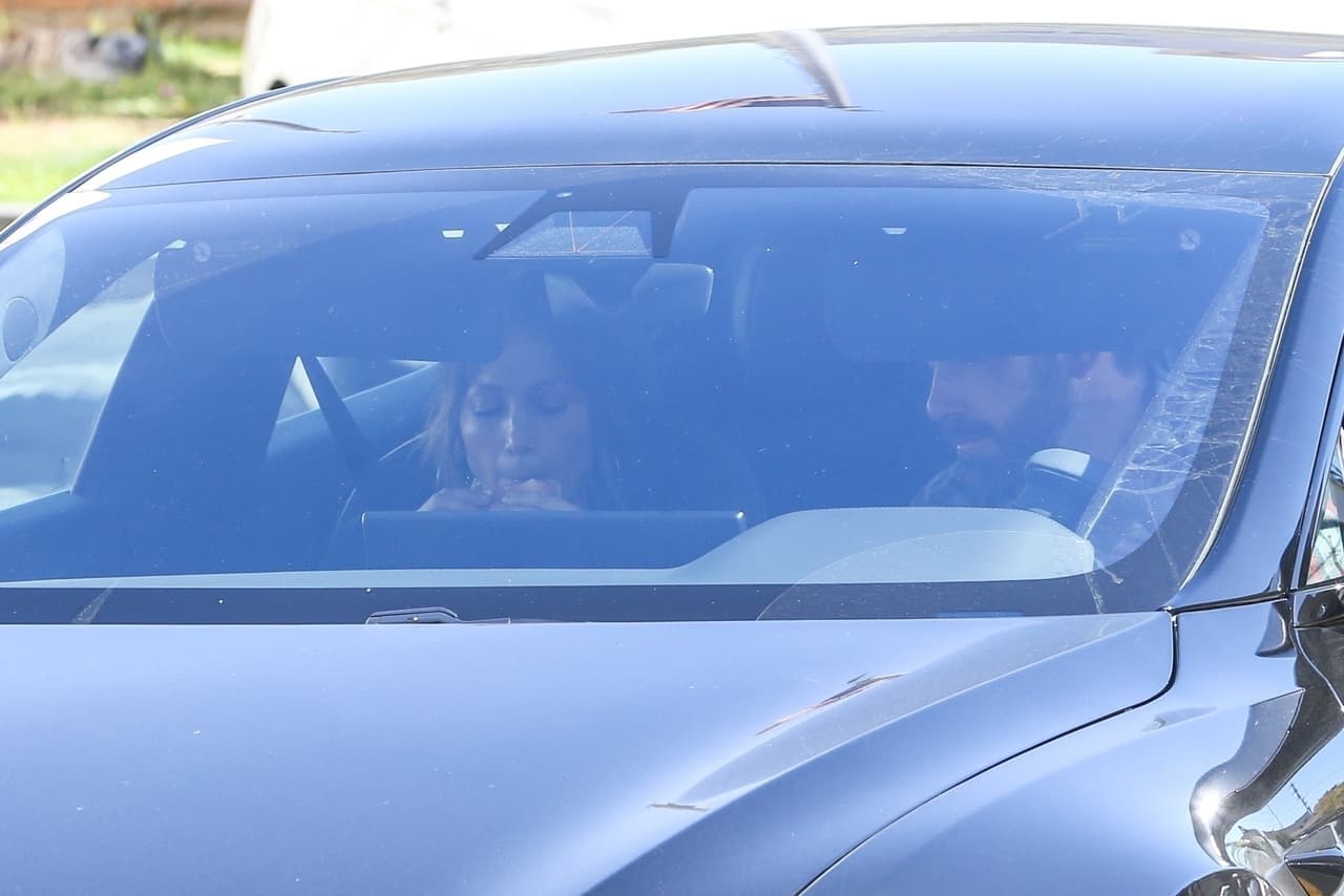 Photo © 2022 Backgrid/The Grosby Group Beverly Hills, CA - *EXCLUSIVE* - **WEB MUST CALL FOR PRICING** Ben Affleck and Jennifer Lopez are spotted in the McDonald's drive-through for a fast-food lunch in Beverly Hills. The couple had gone to visit their new palatial $50 million home earlier and hit up McDonald's for some $1 menu burgers! Ben takes the wheel as he treats his lady to a cheeseburger which the pop star wasted no time in digging into. J-Lo's kids also joined the couple for a bite, however, they were riding in a separate white vehicle. Shot on 03/19/22.