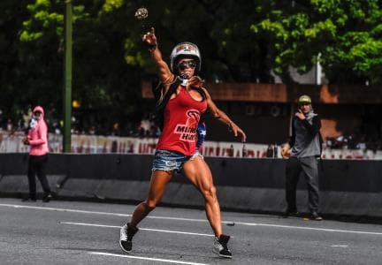 "Venezuelan women are warriors, fighters, we have leadership since we were little," says Caterina Ciarcelluti, the 44-year-old Caracas woman whose helmeted stone-throwing at police earned her the nickname 'Wonder Woman.'
<br>