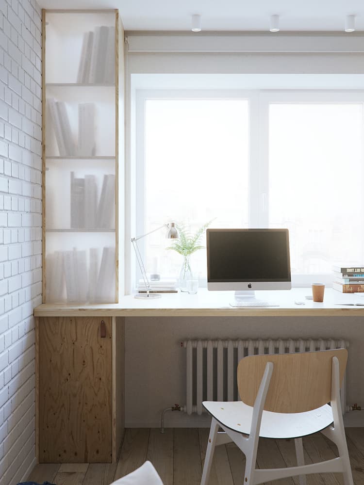 Robarle unos centímetros a la profundidad junto a la ventana permite tener un escritorio de trabajo, con todo y libreros, cubiertos por una película traslúcida que proporciona sensación de ligereza.