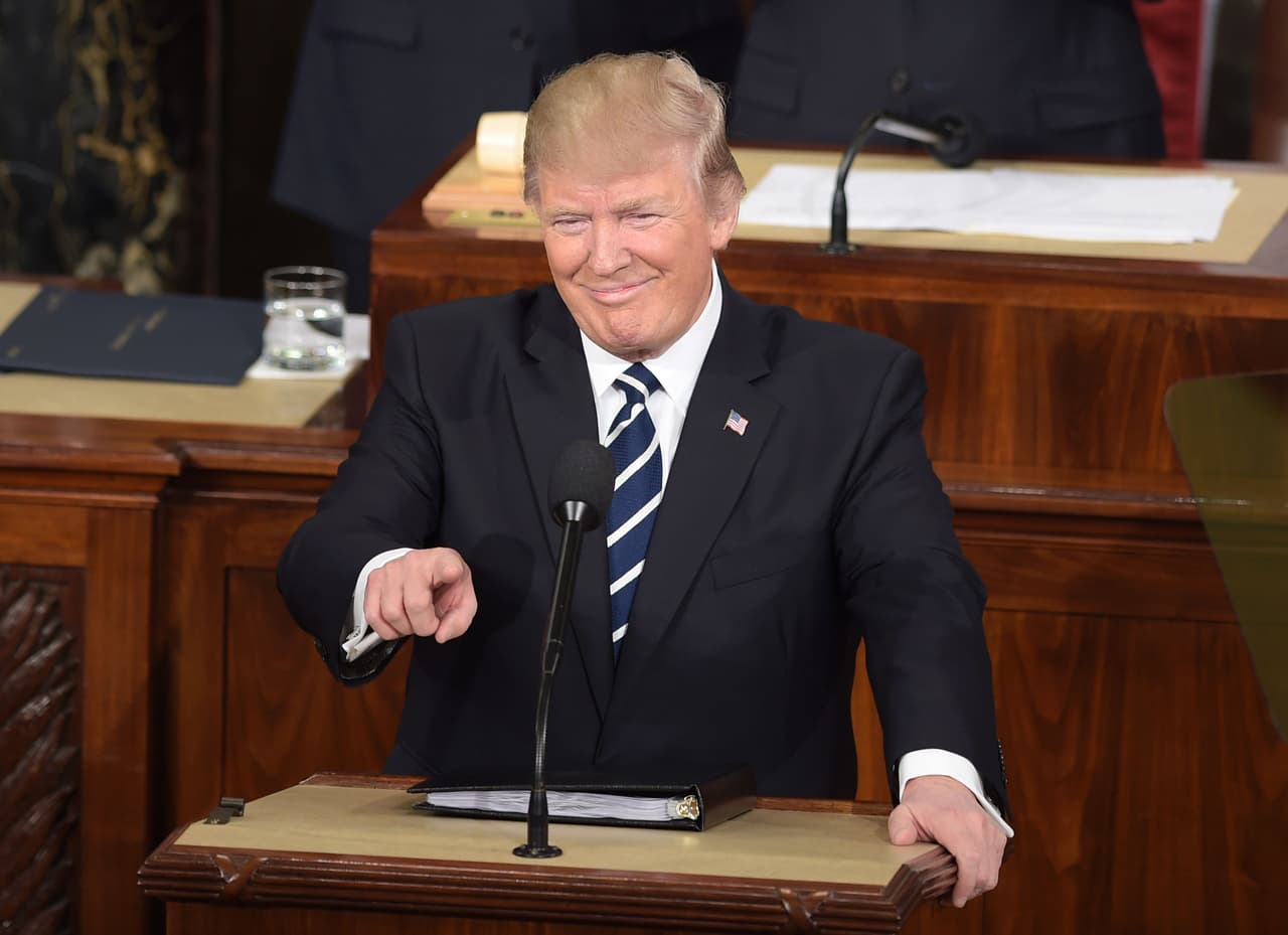 US President Donald Trump (C) arrives to address a joint session of the US Congress on February 28, 2017, in Washington, DC. / AFP / Brendan SMIALOWSKI (Photo credit should read BRENDAN SMIALOWSKI/AFP/Getty Images)