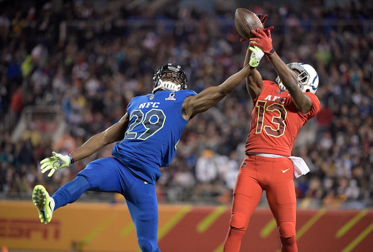 AFC wide receiver T.Y. Hilton (13), of the Indianapolis Colts, attempts to grab a pass, as NFC cornerback Xavier Rhodes (29), of the Minnesota Vikings, defends, during the first half of the NFL Pro Bowl football game Sunday, Jan. 29, 2017, in Orlando, Fla. (AP Photo/Phelan M Ebenhack)