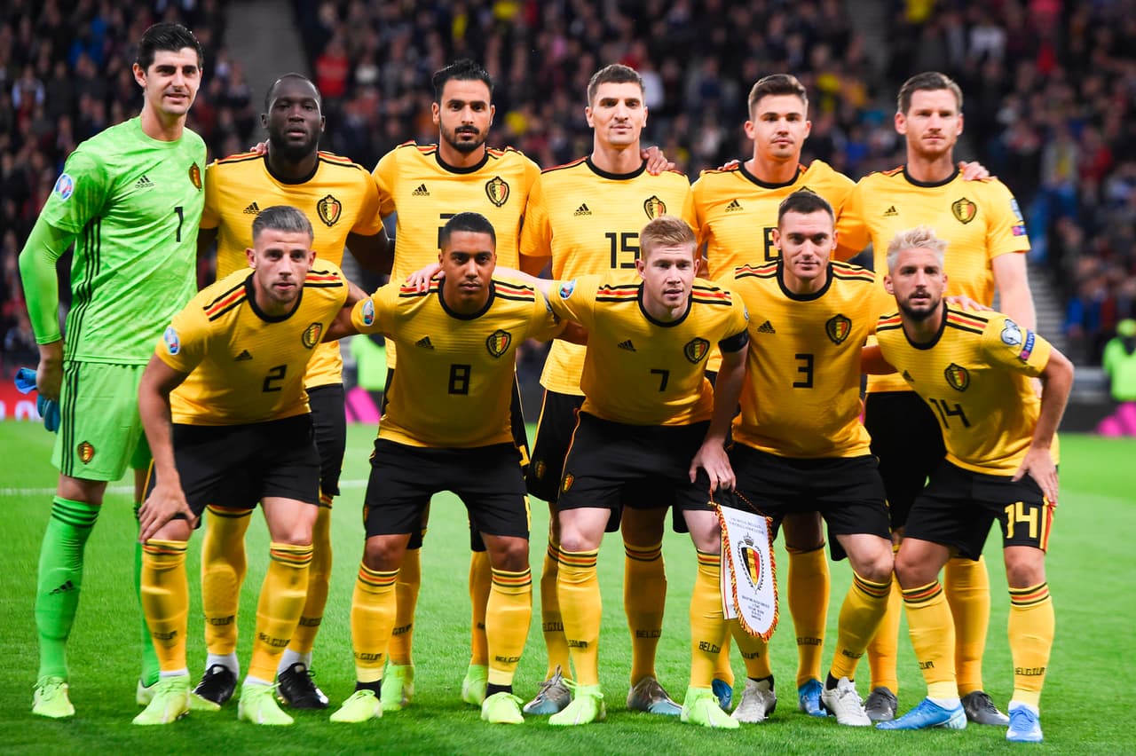 (L-R top) Belgium's goalkeeper Thibaut Courtois, Belgium's striker Romelu Lukaku, Belgium's midfielder Nacer Chadli, Belgium's defender Thomas Meunier, Belgium's midfielder Leander Dendoncker, Belgium's defender Jan Vertonghen, (L-R bottom) Belgium's defender Toby Alderweireld, Belgium's midfielder Youri Tielemans, Belgium's midfielder Kevin De Bruyne, Belgium's defender Thomas Vermaelen and Belgium's midfielder Dries Mertens pose for the official team photograph before kick off of the Euro 2020 football qualification match between Scotland and Belgium at Hampden Park, Glasgow on September 9, 2019. (Photo by ANDY BUCHANAN / AFP) (Photo credit should read ANDY BUCHANAN/AFP via Getty Images)