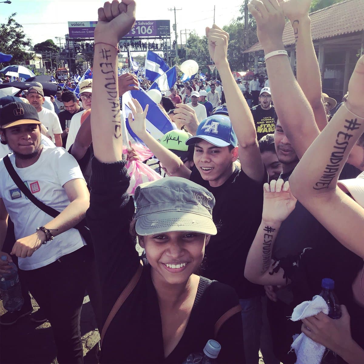 '# students'. Some protesterts tattooed their arms to show their solidarity with the students.