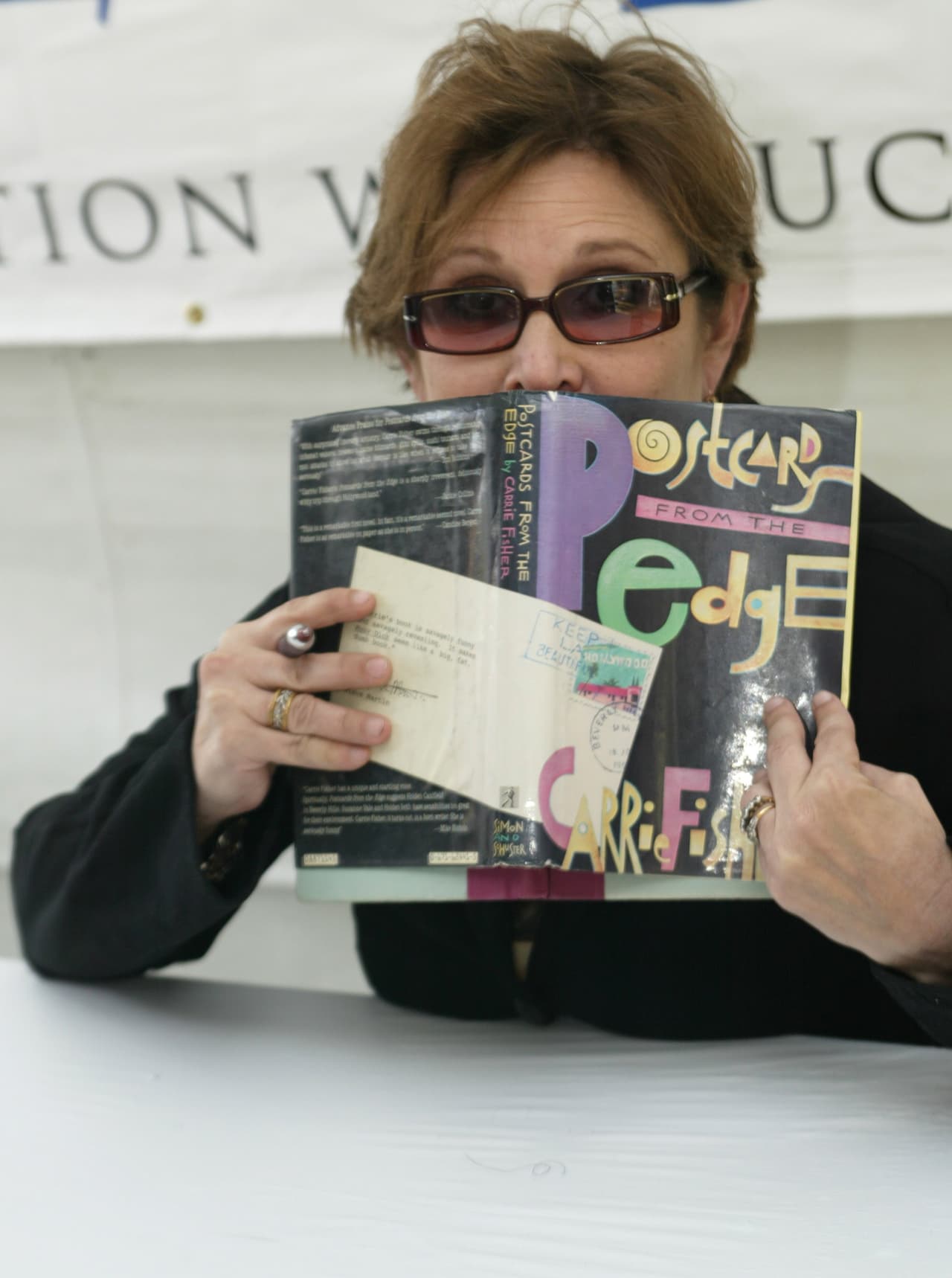 LOS ANGELES - APRIL 23: Actress/writer Carrie Fisher poses as she signs copies of her book "Postcards from the Edge" at the 10th annual Los Angeles Times Festival of Books at UCLA on April 23, 2005 in Los Angeles, California. (Photo by Michael Buckner/Getty Images)