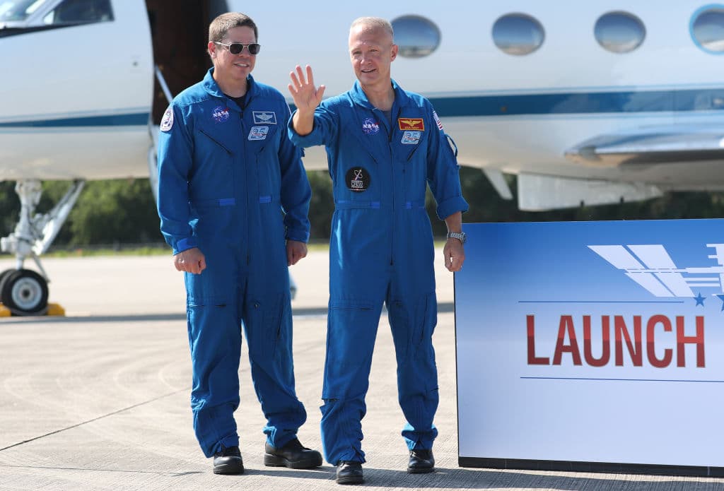 CAPE CANAVERAL, FLORIDA - MAY 20: NASA astronauts Bob Behnken (L) and Doug Hurley pose for photographs after arriving at the Kennedy Space Center on May 20, 2020 in Cape Canaveral, Florida. The astronauts arrived for the May 27th scheduled inaugural flight of SpaceX’s Crew Dragon spacecraft. They will be the first people since the end of the Space Shuttle program in 2011 to be launched into space from the United States. (Photo by Joe Raedle/Getty Images)