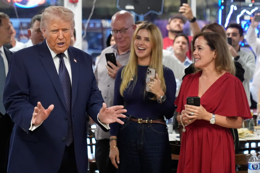 President Donald Trump speaks as he visits Venezuelan restaurant El Arepazo, Monday, March 9, 2026, in Doral, Fla. (AP Photo/Mark Schiefelbein)