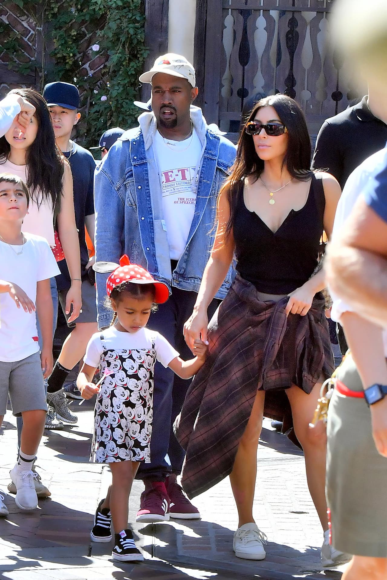 Photo © 2017 Splash News/The Grosby Group EXCLUSIVE Los Angeles, May 23, 2017. Kim Kardashian and Kanye West take their daughter and niece to the happiest place on earth, Disneyland. The group, joined by friends, were seen riding many rides including the teacups, Dumbo, Its a Small World, the gadget go coaster and many other rides on their trip. Kanye even cracked a smile on thunder mountain,