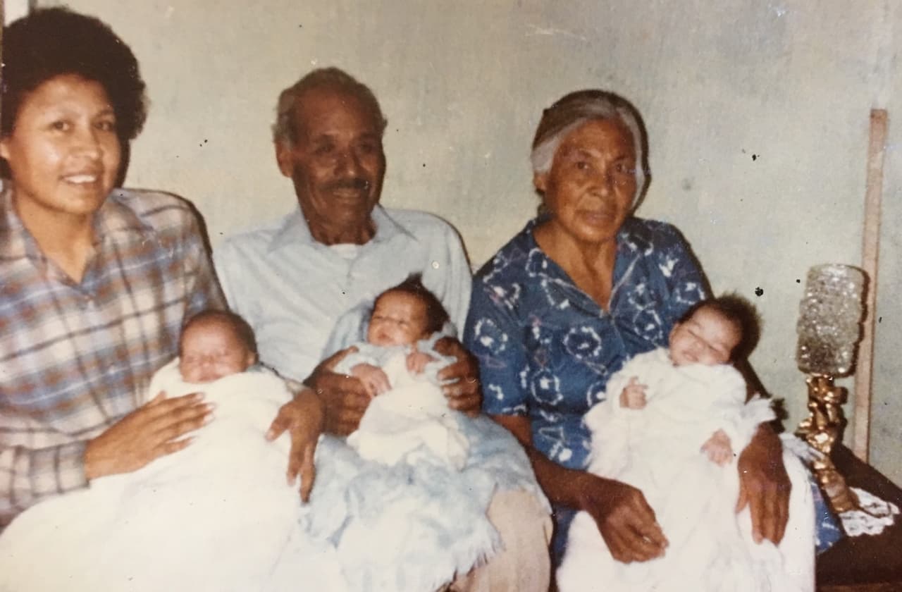 Michael and his sisters with Toni and her parents in Mexico shortly after the children were born in 1985.