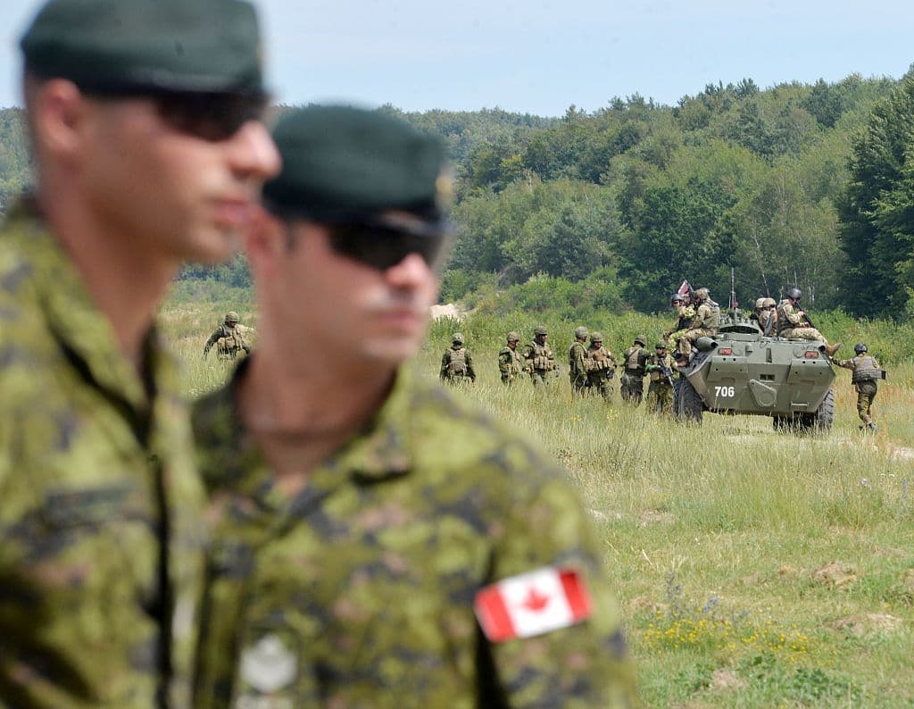 Several other nations participated in the Ukrianina military training, including Canada, Lithuania, Germany and Poland. In this photo, Canadian military instructors look on during Ukrainian military exercises at the International Peacekeeping and Security Center in Yavoriv, near Lviv, on July 12, 2016.