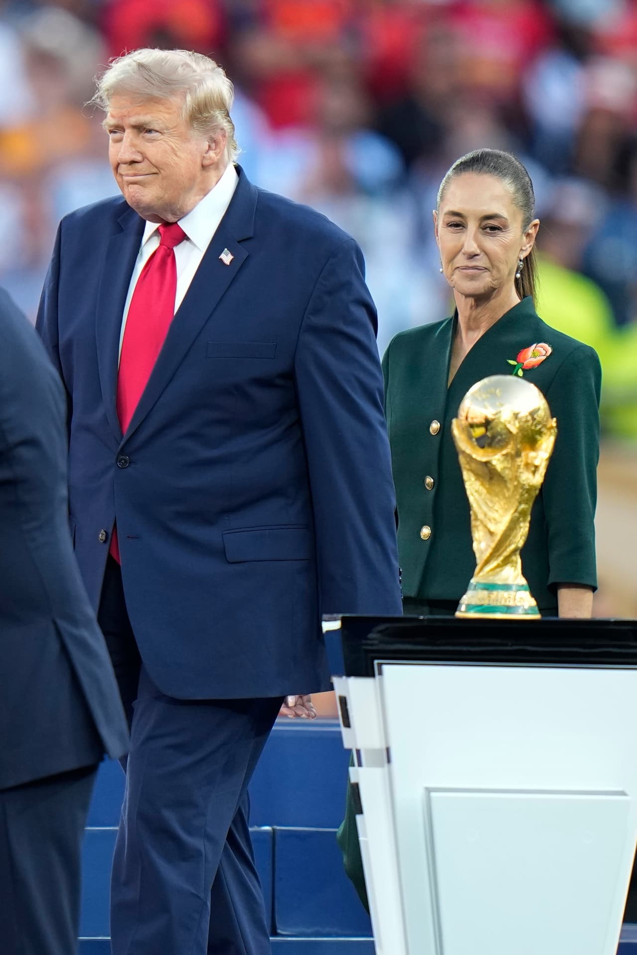 U.S. President Donald J. Trump walks past the winners' trophy during the presentation ceremony after the World Cup final soccer match between Spain and Argentina in East Rutherford, N.J., near New York, Sunday, July 19, 2026. (AP Photo/Frank Franklin II)