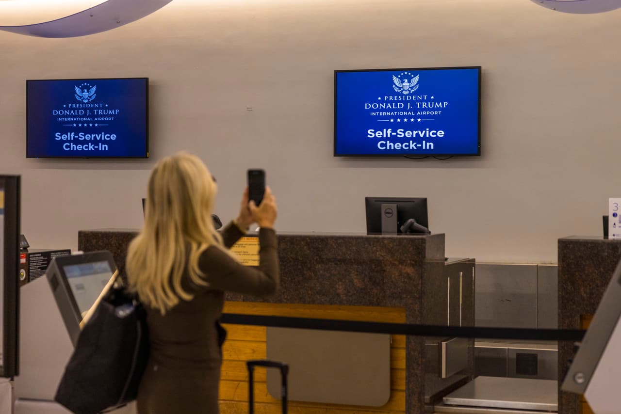 Monitors at a check-in counter display the name of the rebranded Donald J. Trump International Airport in West Palm Beach, Fla., Thursday, July 9, 2026.