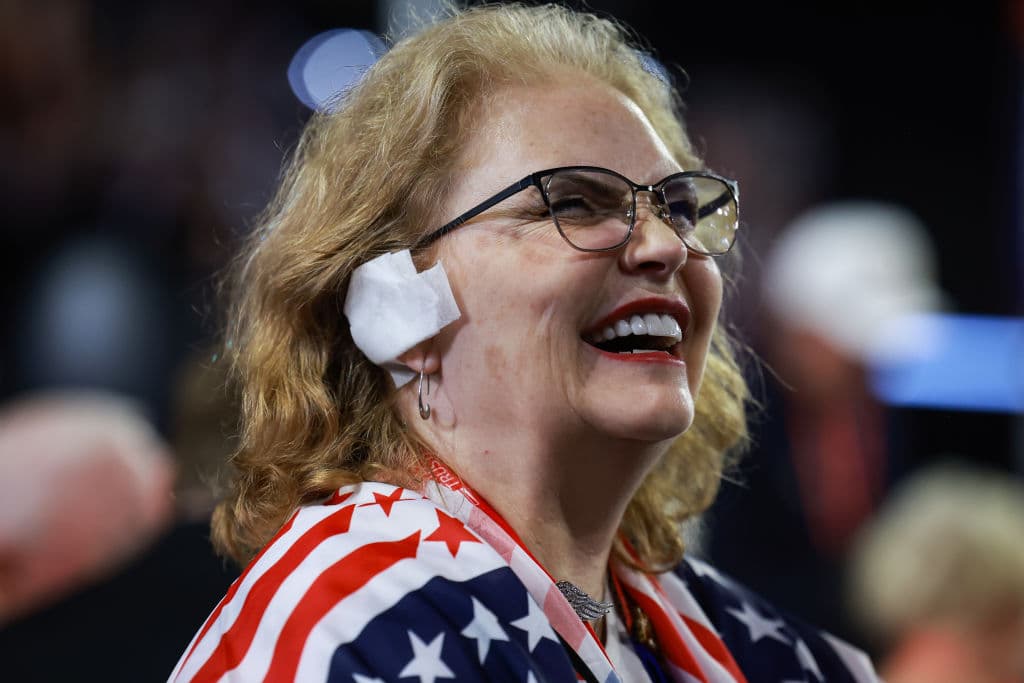 MILWAUKEE, WISCONSIN - JULY 17: Arizona delegate Susan Ellsworth wears a 'bandage' on her ear on the third day of the Republican National Convention at the Fiserv Forum on July 17, 2024 in Milwaukee, Wisconsin. Delegates, politicians, and the Republican faithful are in Milwaukee for the annual convention, concluding with former President Donald Trump accepting his party's presidential nomination. The RNC takes place from July 15-18. (Photo by Joe Raedle/Getty Images)