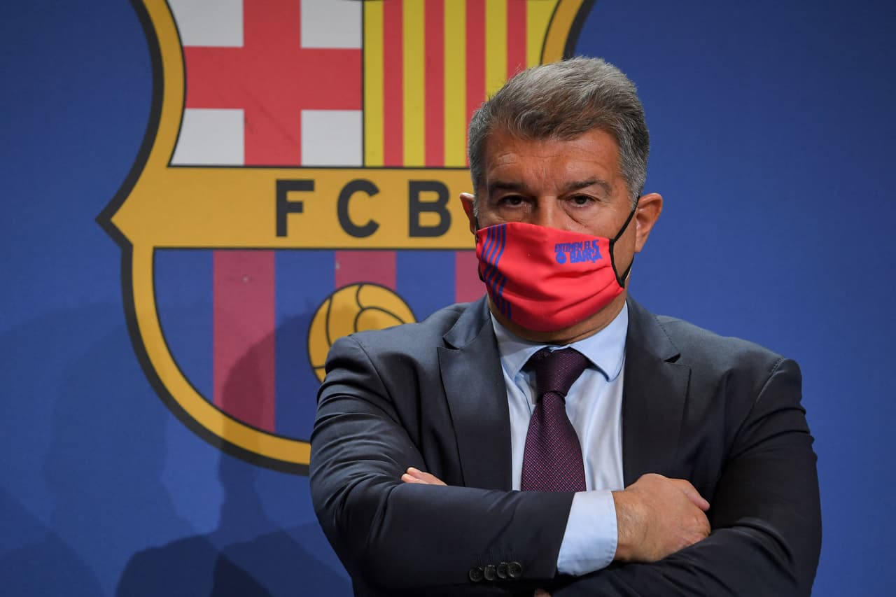 Barcelona's Spanish President Joan Laporta looks on during a press conference to present the results of a club investigation into financial mismanagement under the previous board, in Barcelona on February 1, 2022. - The "forensic report" focuses on various financial issues, including money paid to agents and the spreading of fees over numerous contracts, allegedly to avoid exceeding spending limits, with former president Josep Maria Bartomeu expected to be in the firing line. (Photo by LLUIS GENE / AFP) (Photo by LLUIS GENE/AFP via Getty Images)