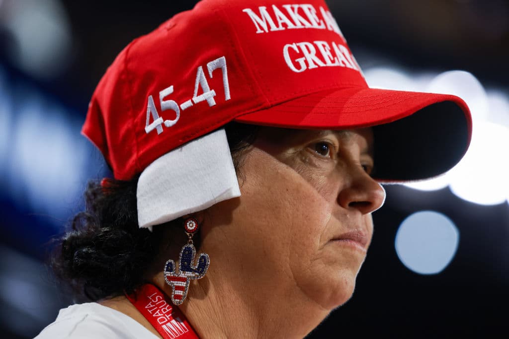 MILWAUKEE, WISCONSIN - JULY 17: Arizona delegate Stacy Goodman wears a 'bandage' on her ear on the third day of the Republican National Convention at the Fiserv Forum on July 17, 2024 in Milwaukee, Wisconsin. Delegates, politicians, and the Republican faithful are in Milwaukee for the annual convention, concluding with former President Donald Trump accepting his party's presidential nomination. The RNC takes place from July 15-18. (Photo by Joe Raedle/Getty Images)