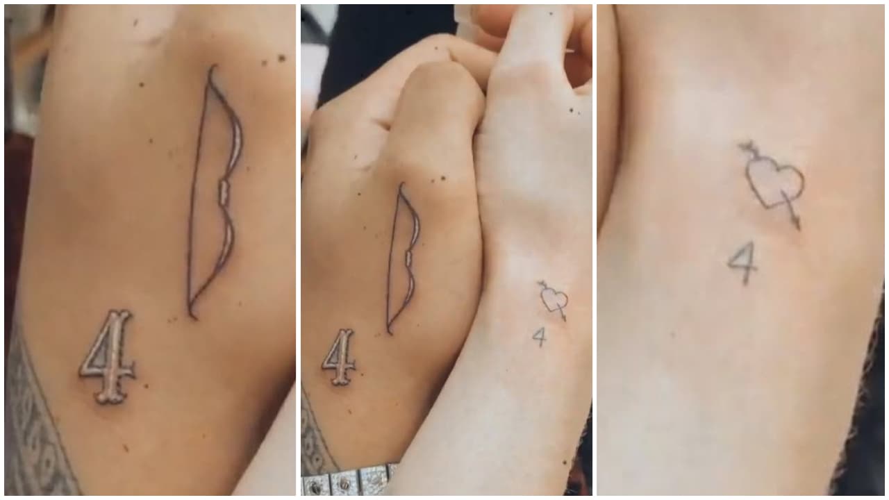 El cantante tiene el arco con un cuatro, mientras que la actriz tiene un corazón flechado y también el mismo número.
<br>