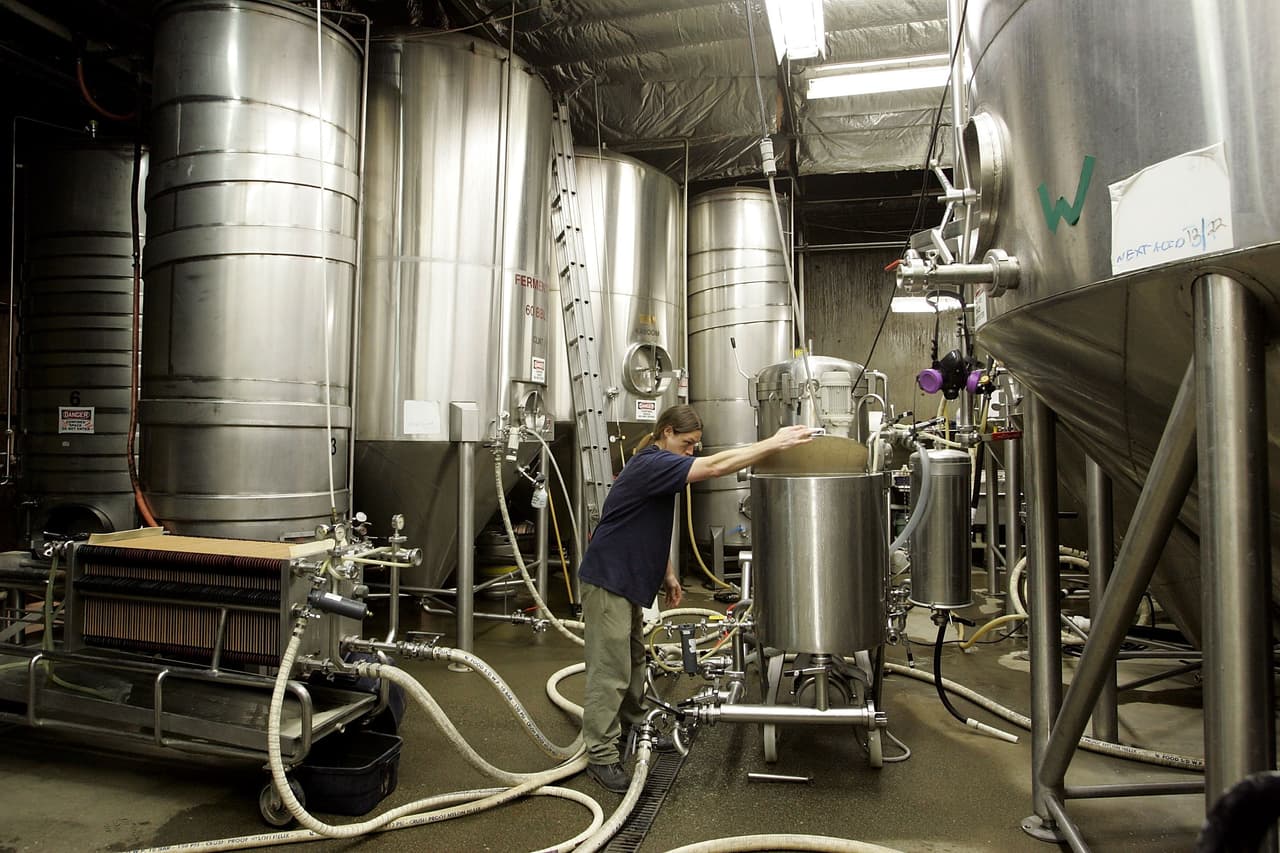 PETALUMA, CA - MARCH 28: Lagunitas Brewing Company brewer Jeremy Marshall checks on a tank at the brewery March 28, 2006 in Petaluma, California. Production of craft and micro-brewed beer grew by 9 percent last year, the biggest jump since 1996, while mainstream beer sales fell as beer drinkers seek a better and more unique tasting beer. (Photo by Justin Sullivan/Getty Images)