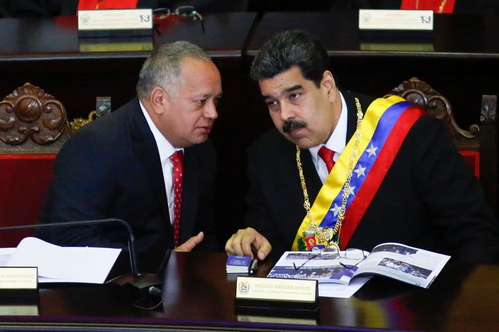 CARACAS, VENEZUELA - JANUARY 24: President of Venezuela Nicolás Maduro (R) talks to President of the Constituent Assembly Diosdado Cabello (L) before talkig to judges and members of the Supreme Justice Tribunal on its annual opening day of sessions on January 24 in Caracas, Venezuela. Yesterday opposition leader and head of the National Assembly Juan Guaidó declared self interim president. Several countries including US, France and Brazil accepted Guaidó as the legitimate temporary ruler of the country. In response, Nicolás Maduro urged American diplomats to leave Venezuela in 72 hours breaking diplomatic relationships. (Photo by Getty Images/Getty Images)
