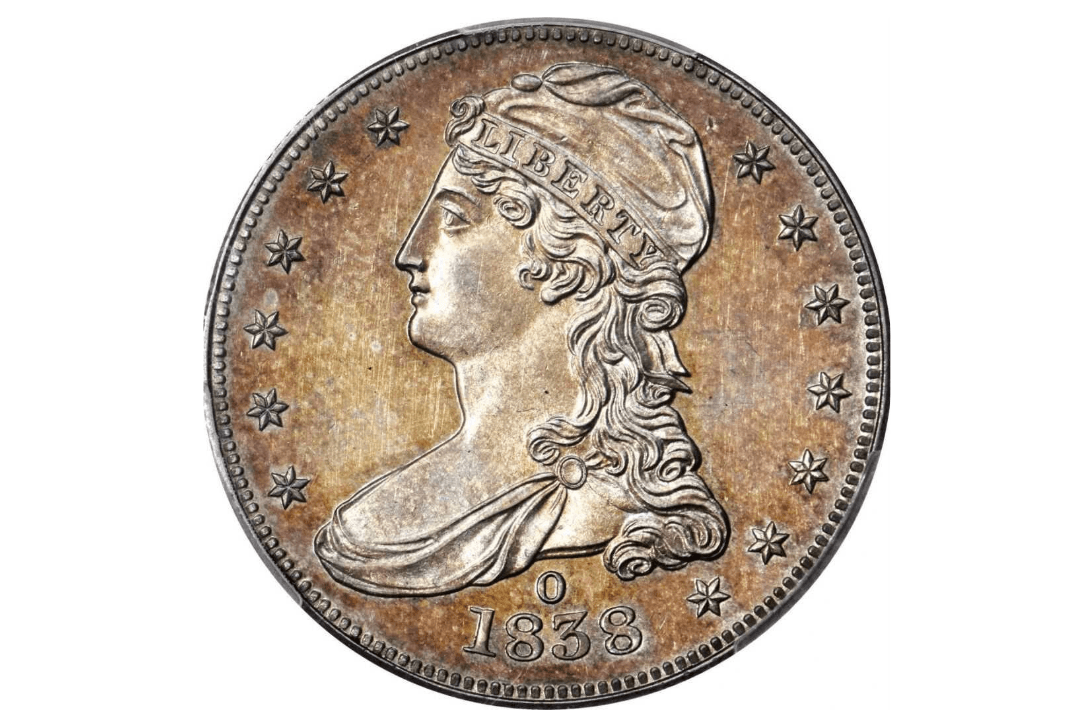 La costosa moneda es denominada Cox Specimen, presenta a una mujer que lleva una banda que dice "Libertad" en una cara, y debajo del busto la letra ‘O’ identificando la casa de moneda en donde fue creada y el símbolo nacional del águila calva en la otra.