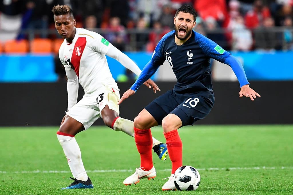 France's midfielder Nabil Fekir (R) goes down after a tackle by Peru's midfielder Pedro Aquino during the Russia 2018 World Cup Group C football match between France and Peru at the Ekaterinburg Arena in Ekaterinburg on June 21, 2018. (Photo by Anne-Christine POUJOULAT / AFP) / RESTRICTED TO EDITORIAL USE - NO MOBILE PUSH ALERTS/DOWNLOADS (Photo credit should read ANNE-CHRISTINE POUJOULAT/AFP/Getty Images)