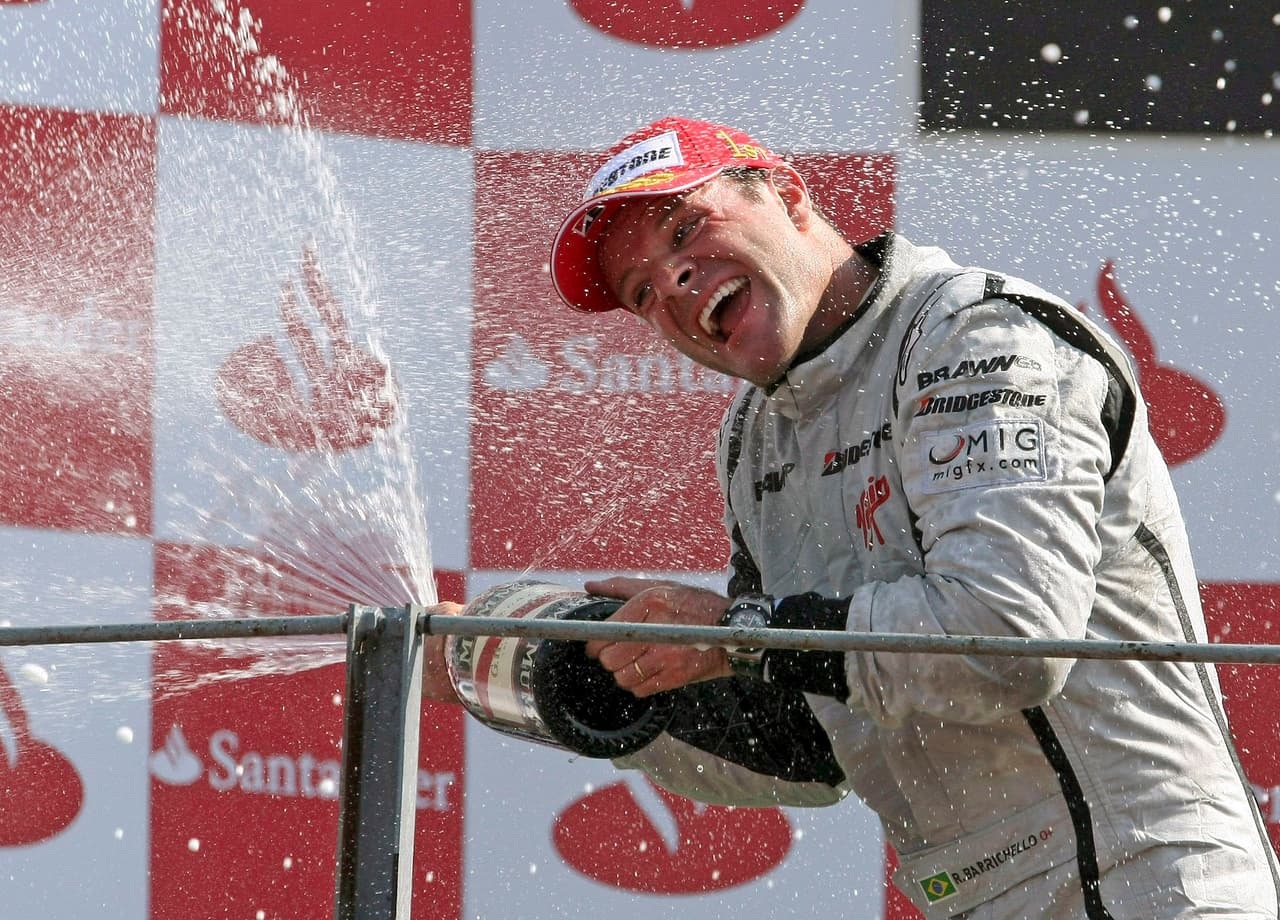 Brawn GP driver Rubens Barrichello of Brazil celebrates on the podium after winning the Italian Formula One Grand Prix, at the Monza racetrack, Sunday, Sept. 13, 2009. (AP Photo/Alex Trovati)