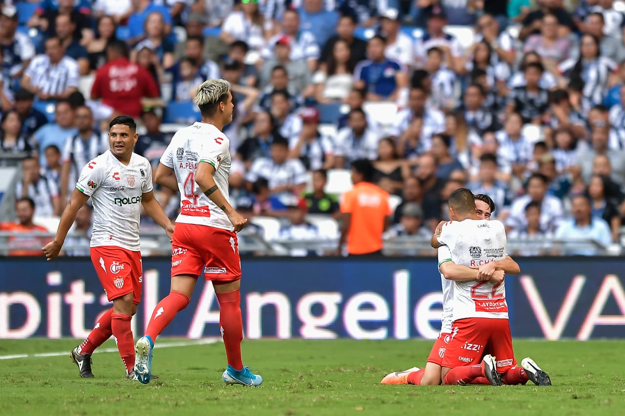 MONTERREY, MEXICO - SEPTEMBER 14: Jesús Angulo, #20 of Necaxa, celebrates with teammates after scoring his team’s second goal during the 9th round match between Monterrey and Necaxa as part of the Torneo Apertura 2019 Liga MX at BBVA Stadium on September 14, 2019 in Monterrey, Mexico. (Photo by Azael Rodriguez/Getty Images)
