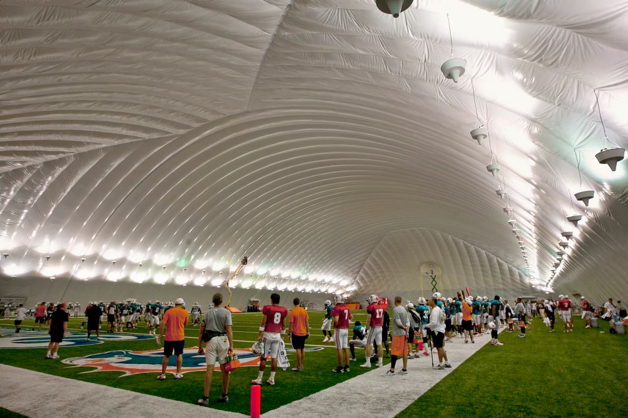 Miami Dolphins practice inside the bubble because of rain at Dolphins training camp at NSU in Davie, Florida, Monday, August 6, 2012. (Joe Rimkus Jr./Miami Herald/MCT via Getty Images)