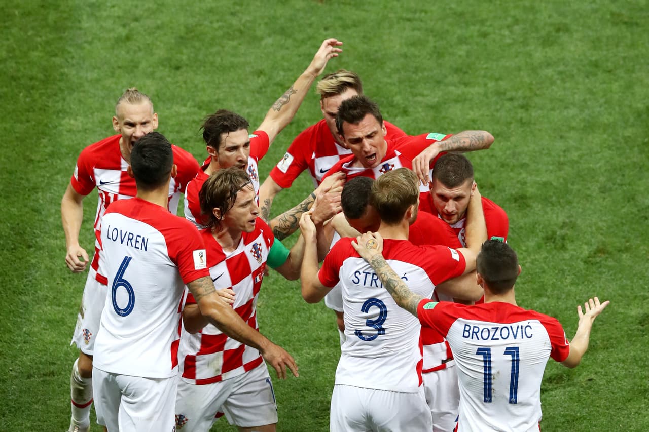 MOSCOW, RUSSIA - JULY 15: Ivan Perisic of Croatia celebrates with team mates after scoring his team's first goal during the 2018 FIFA World Cup Final between France and Croatia at Luzhniki Stadium on July 15, 2018 in Moscow, Russia. (Photo by Ryan Pierse/Getty Images)