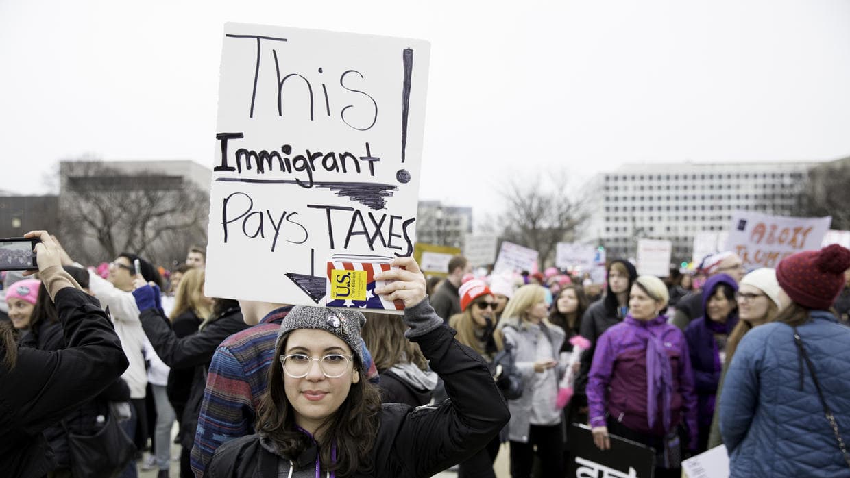 A women holds a sign at the Women's March on Washington.