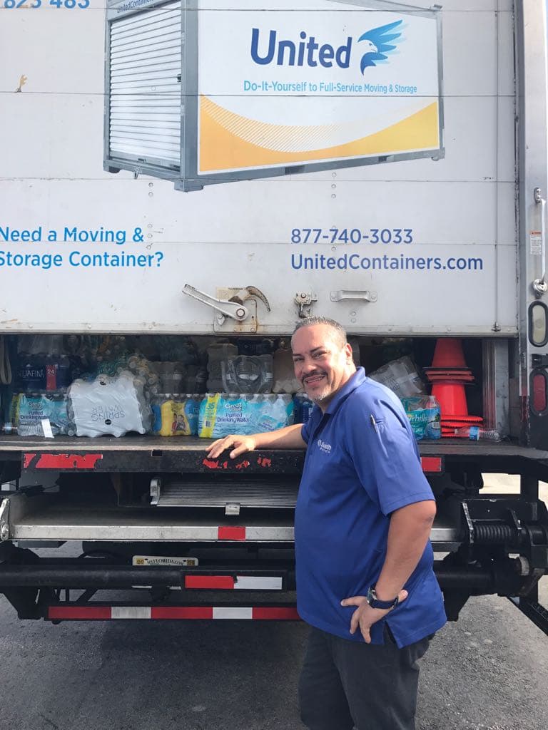 Wilfredo Pabon, a Nuyorican with donations on a truck from Unitedcontainers.com storage company.