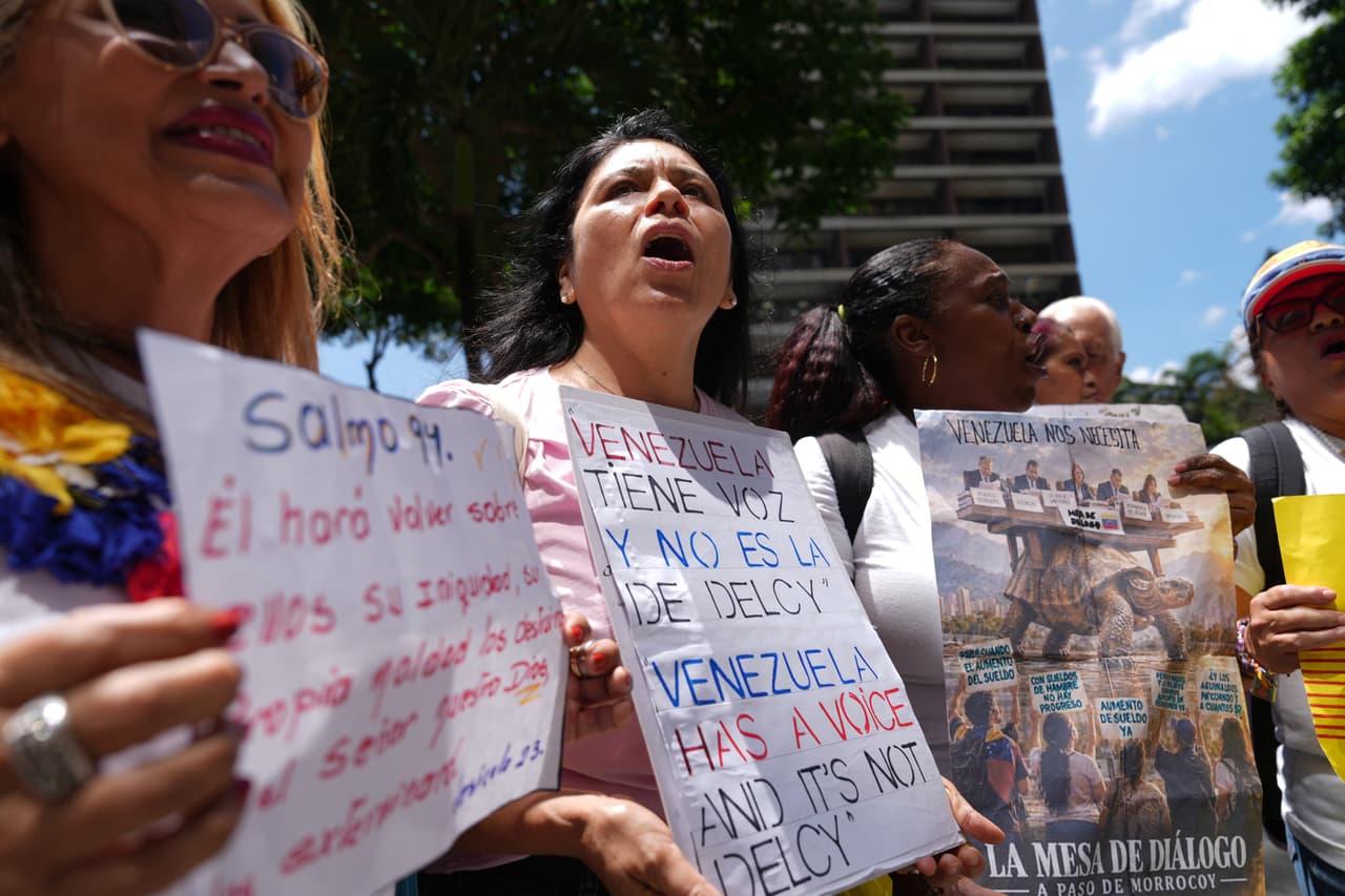 Demonstrators gather outside the United Nations headquarters in Caracas, Venezuela, to protest acting Venezuelan President Delcy Rodriguez's participation at the U.N. General Assembly, Tuesday, Sept. 22, 2026. (AP Photo/Ariana Cubillos)