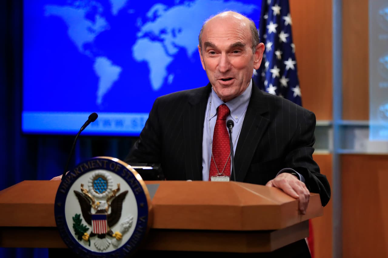 Elliott Abrams talks to reporters after Secretary of State Mike Pompeo named the hawkish former Republican official to handle U.S. policy toward Venezuela during a news conference at the State Department in Washington, Friday, Jan. 25, 2019. The appointment of Abrams follows the Trump administration's decision this week to recognize the leader of Venezuela's parliament as the country's legitimate leader and call for President Nicolas Maduro to step down. (AP Photo/Manuel Balce Ceneta)