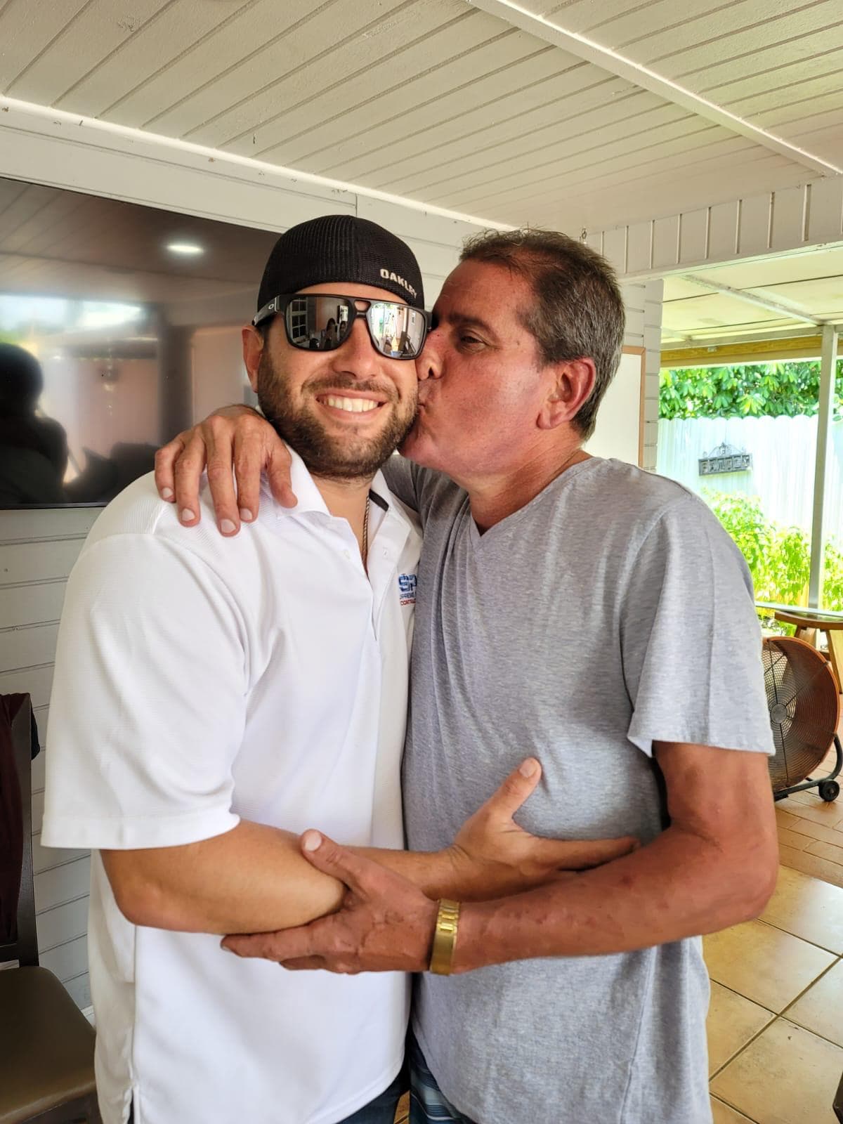 Addiel Elias, left, and his father Benito Elias after they were reunited in Miami. Addiel left Cuba in 2017 and started his own plumbing business. His father, Benito, left Cuba by raft in July, taking five days to reach the Florida coast.
