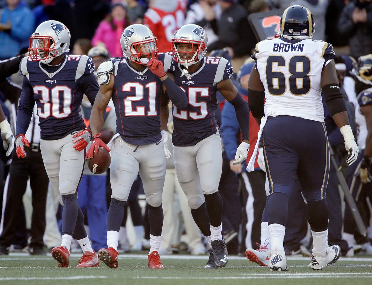 New England Patriots cornerback Malcolm Butler (21) celebrates his interception against the Los Angeles Rams during the first half of an NFL football game, Sunday, Dec. 4, 2016, in Foxborough, Mass. (AP Photo/Elise Amendola)