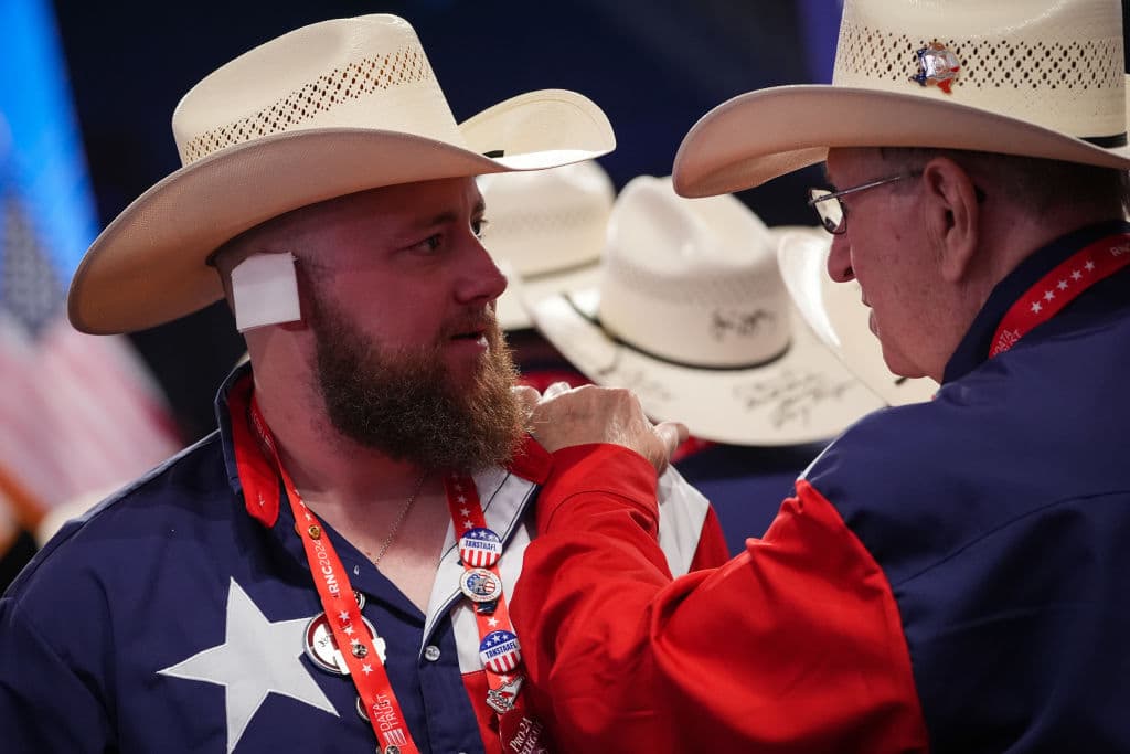 MILWAUKEE, WISCONSIN - JULY 17: A man wearing a cowboy hat has a "bandage" on his ear on the third day of the Republican National Convention at the Fiserv Forum on July 17, 2024 in Milwaukee, Wisconsin. Delegates, politicians, and the Republican faithful are in Milwaukee for the annual convention, concluding with former President Donald Trump accepting his party's presidential nomination. The RNC takes place from July 15-18. (Photo by Andrew Harnik/Getty Images)