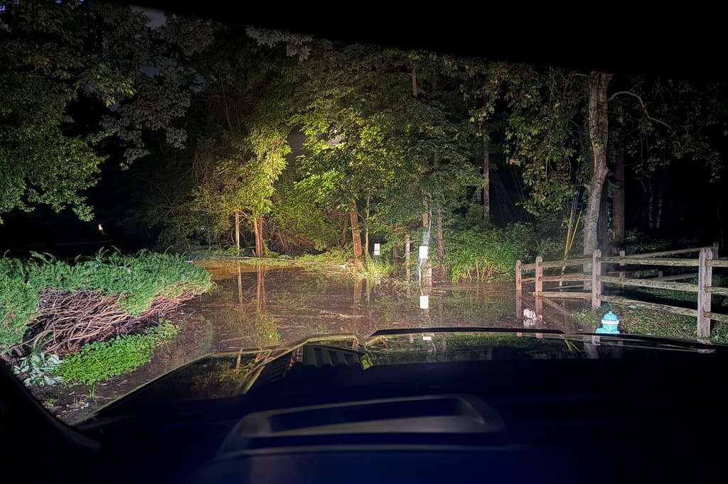 This photo provided by the Indianapolis Fire Department shows flooding in northern Indianapolis, Ind., Saturday, Aug. 15, 2026. (Indianapolis Fire Department via AP)