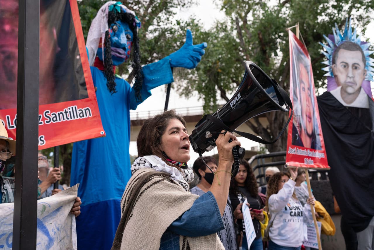 Ana Maria Vasquez, activist with the Border Patrol Victims Network, leads chants during a march to honor victims of US Border Patrol shootings, in Nogales, Sonora, Mexico, on October 9, 2022. - Elena Rodríguez was fatally shot through the US-Mexico border wall by US Border Patrol agent Lonnie Swartz in 2012. This march was part of a weekend of events called On The Line: 2022 Border Convening. (Photo by MAX HERMAN / AFP) (Photo by MAX HERMAN/AFP via Getty Images)