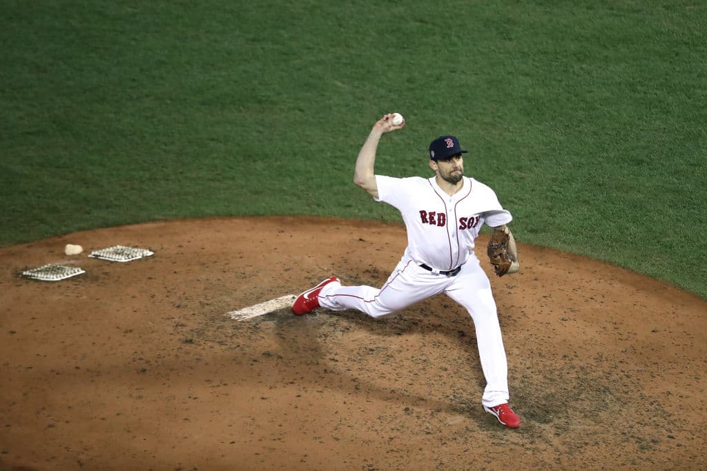 BOSTON, MA - OCTOBER 24: Nathan Eovaldi #17 of the Boston Red Sox delivers the pitch during the eighth inning against the Los Angeles Dodgers in Game Two of the 2018 World Series at Fenway Park on October 24, 2018 in Boston, Massachusetts. (Photo by Al Bello/Getty Images)
