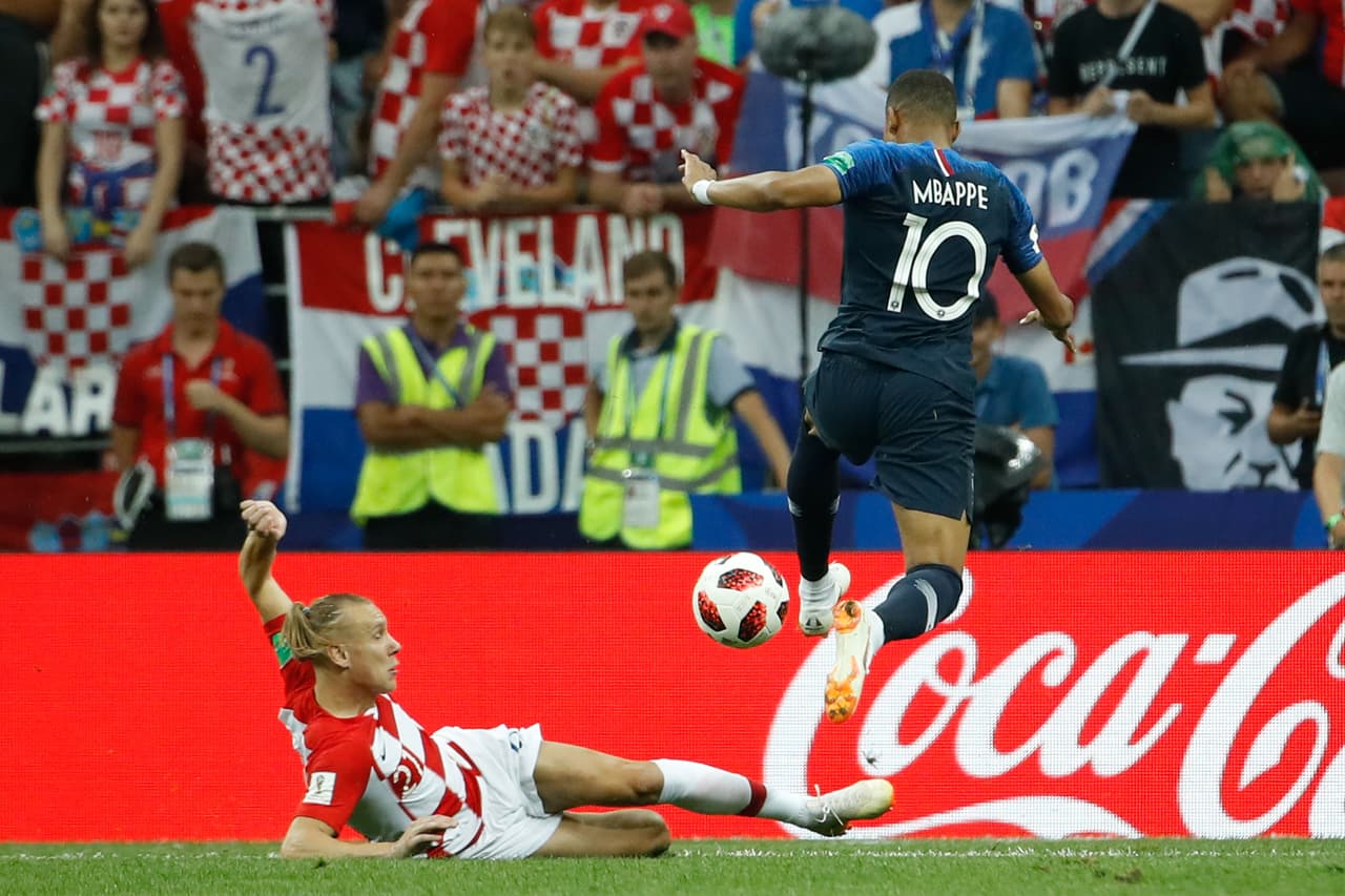 France's forward Kylian Mbappe and Croatia's defender Domagoj Vida vie for the ball during the Russia 2018 World Cup final football match between France and Croatia at the Luzhniki Stadium in Moscow on July 15, 2018. (Photo by Odd ANDERSEN / AFP) / RESTRICTED TO EDITORIAL USE - NO MOBILE PUSH ALERTS/DOWNLOADS (Photo credit should read ODD ANDERSEN/AFP/Getty Images)