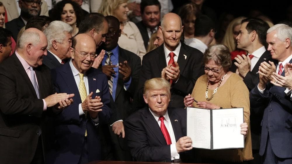 President Trump signing a new Cuba policy order in Miami, June 16, 2017. (Left to right: Secretary of State Rex Tillerson, Commerce Secretary Wilbur Ross, Florida Governor Rick Scott, Senator Marco Rubio, Vice President Mike Pence.)